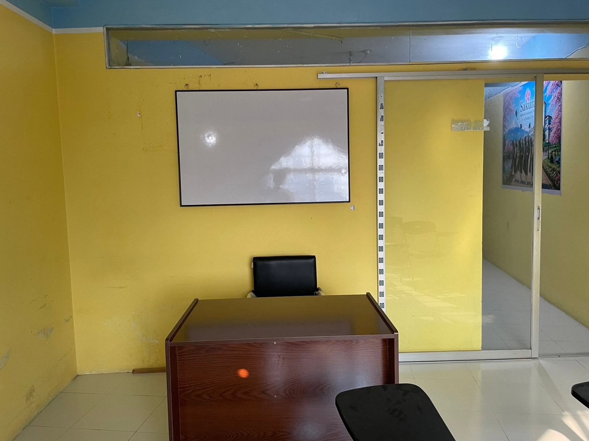 Sakura JLTC teacher room with whiteboard projector