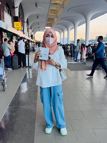Sakura JLTC student holding Japan visa